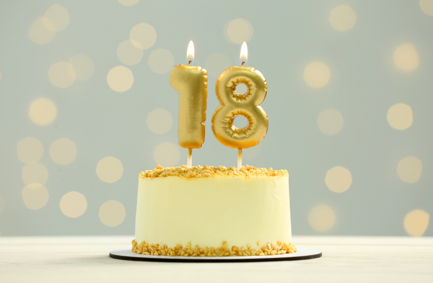Birthday cake with number 18 representing when a child becomes a legal adult and parents lose decision-making authority